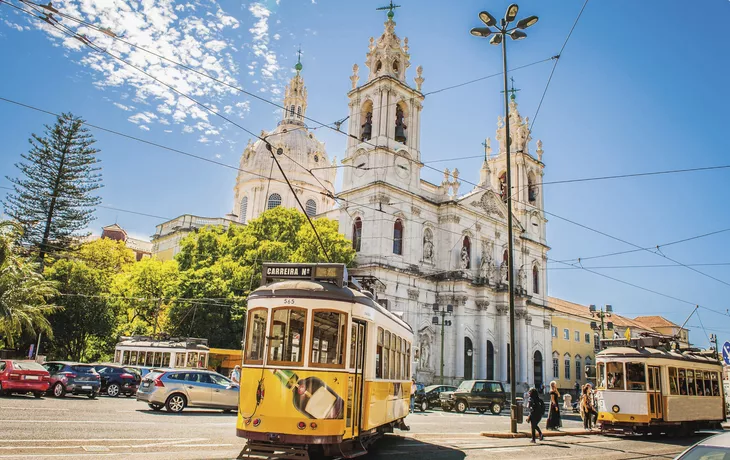 Yellow tram 28 on streets of Lisbon, Portugal